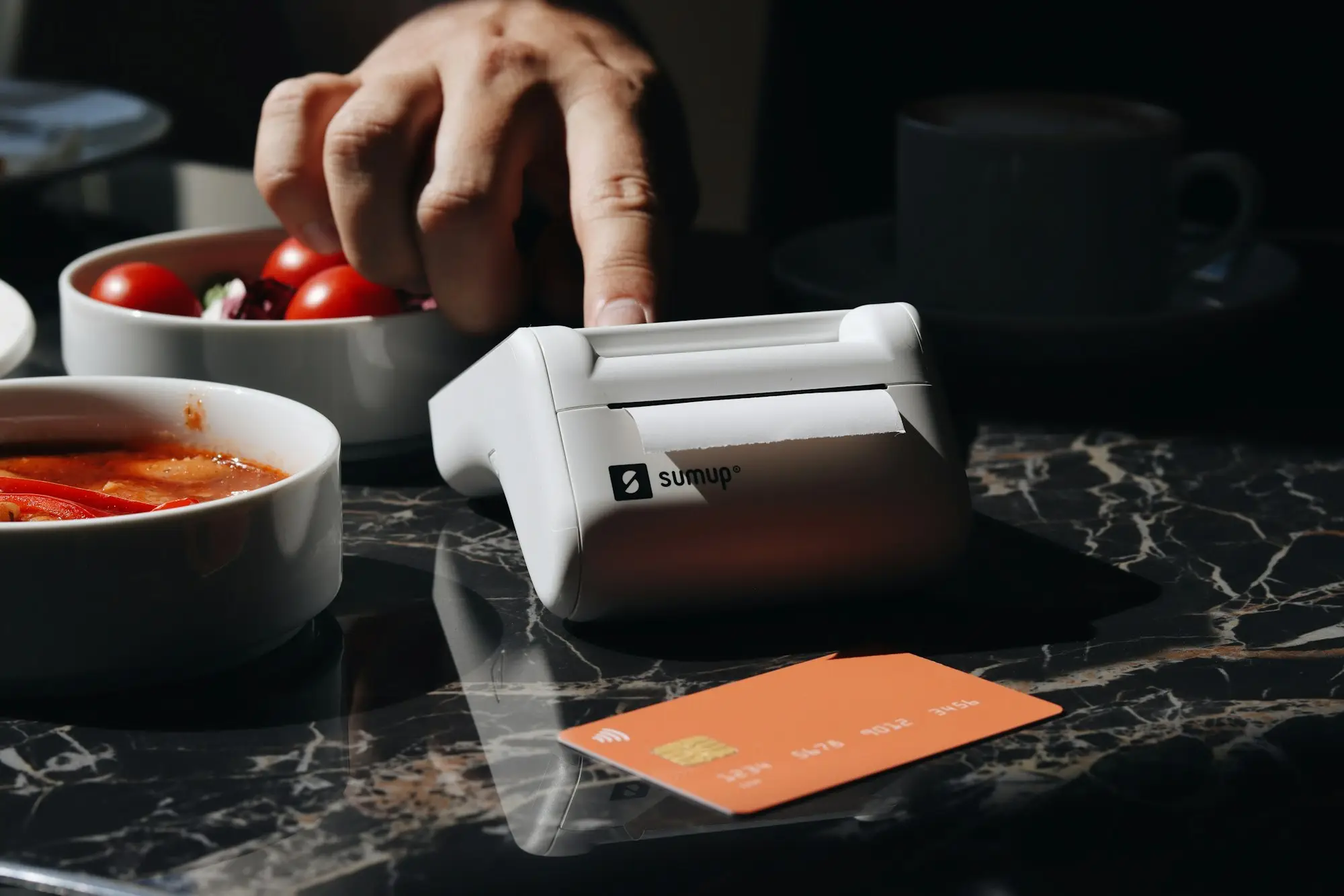 Card payment terminal on a cafe counter