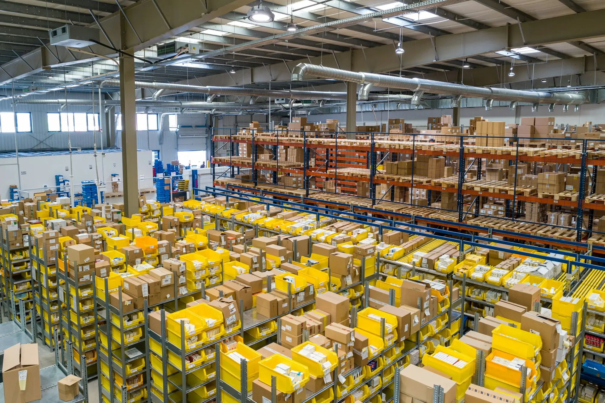 Warehouse floor stacked with boxed stock on pallets
